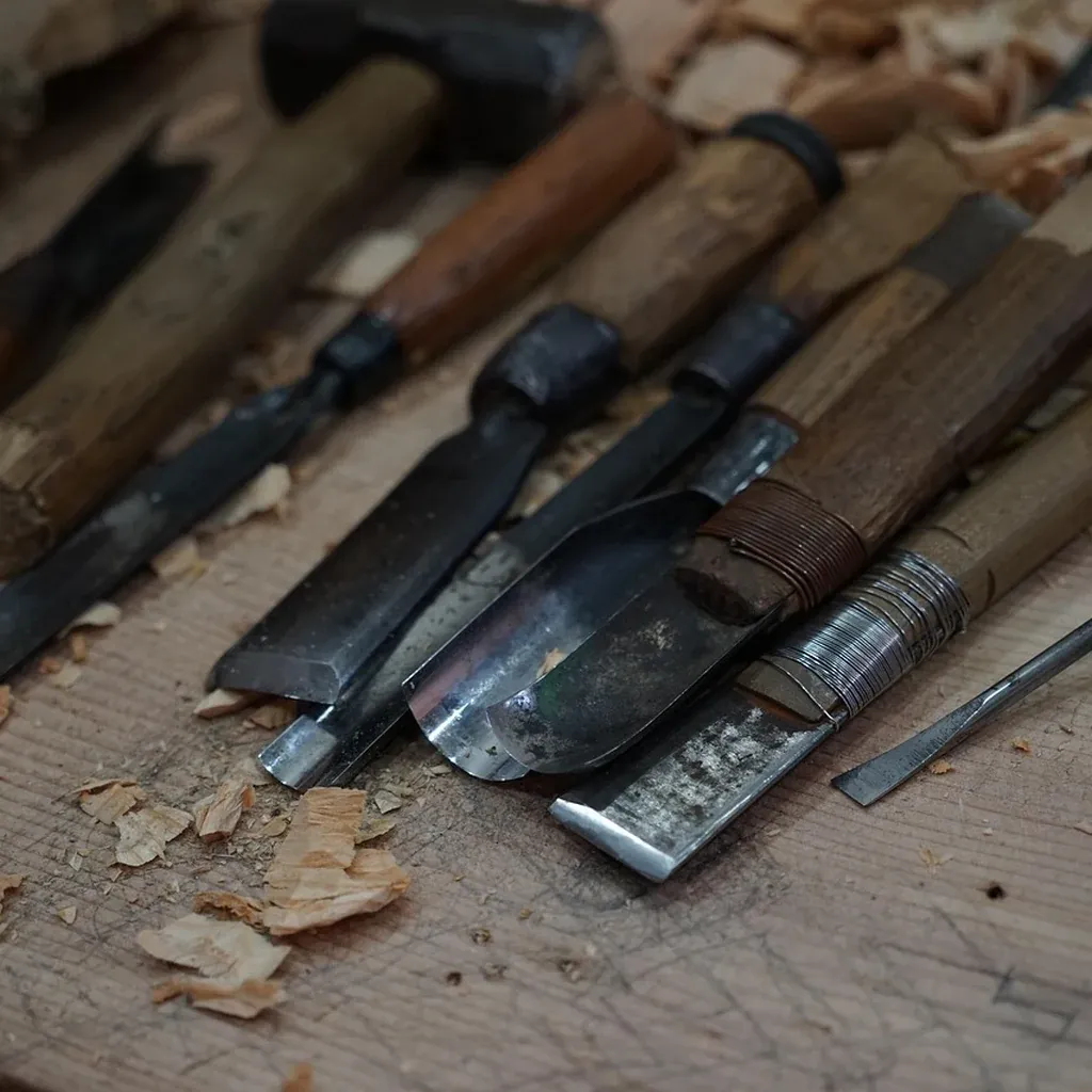 Chisel work on a mortise Close-up of a chisel blade and its steel edge