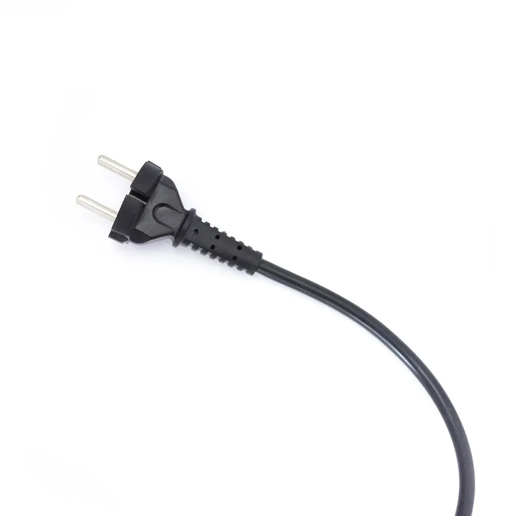 Power cord and outlet Electrical cord plugged into a wall outlet