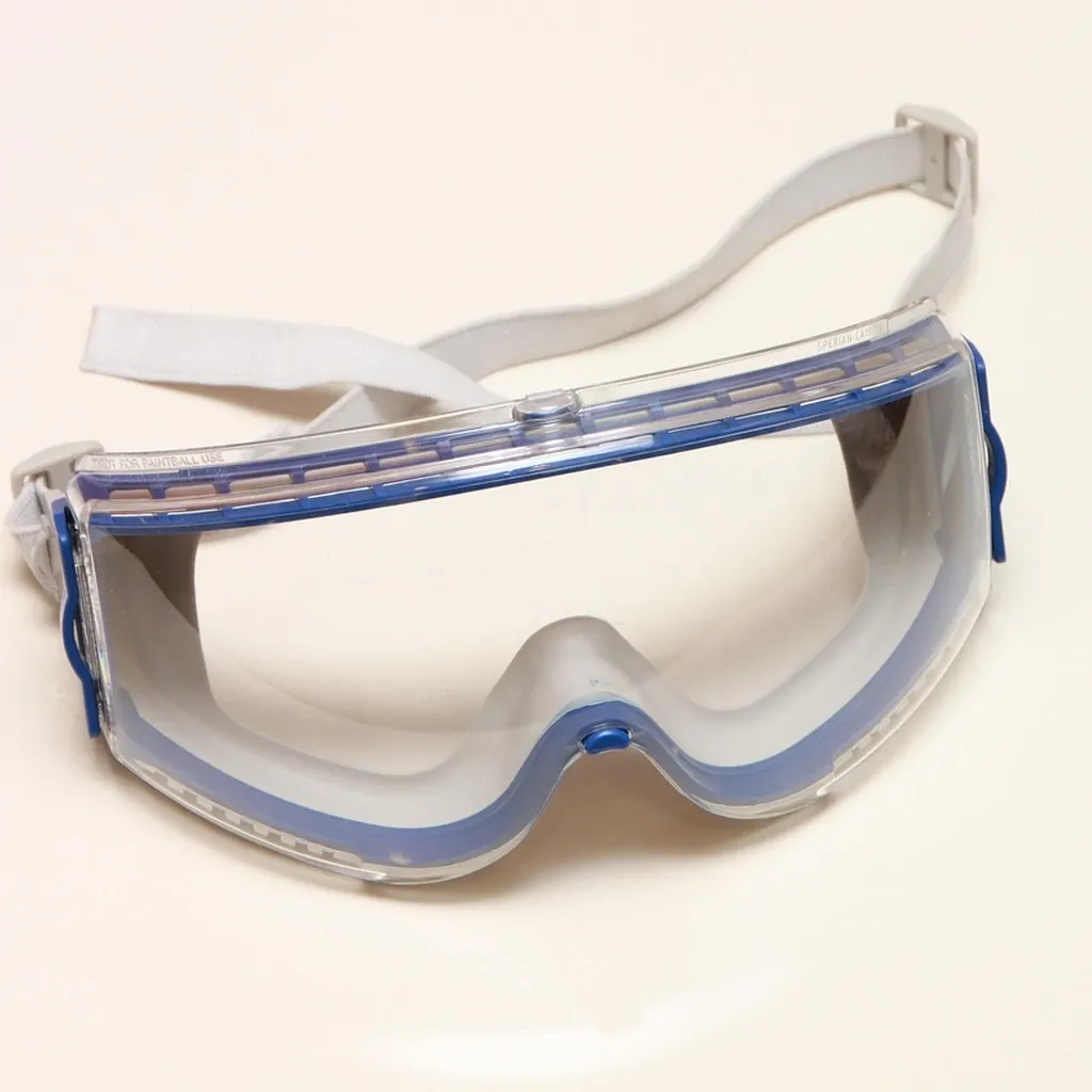 Safety gear on the bench Clear safety glasses resting on a workbench next to tools