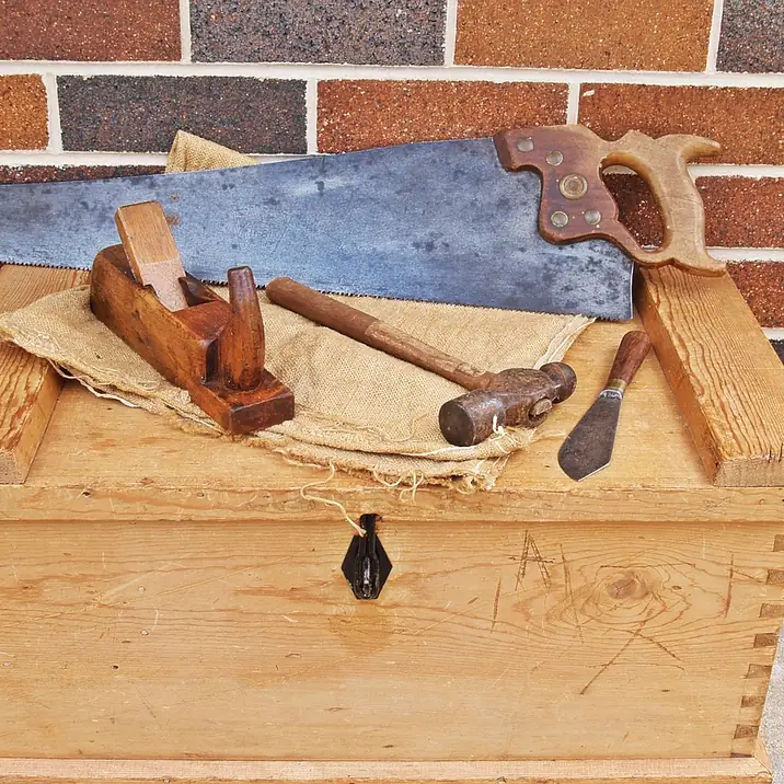 A small project tool kit Carpenter's toolbox holding a small set of woodworking hand tools