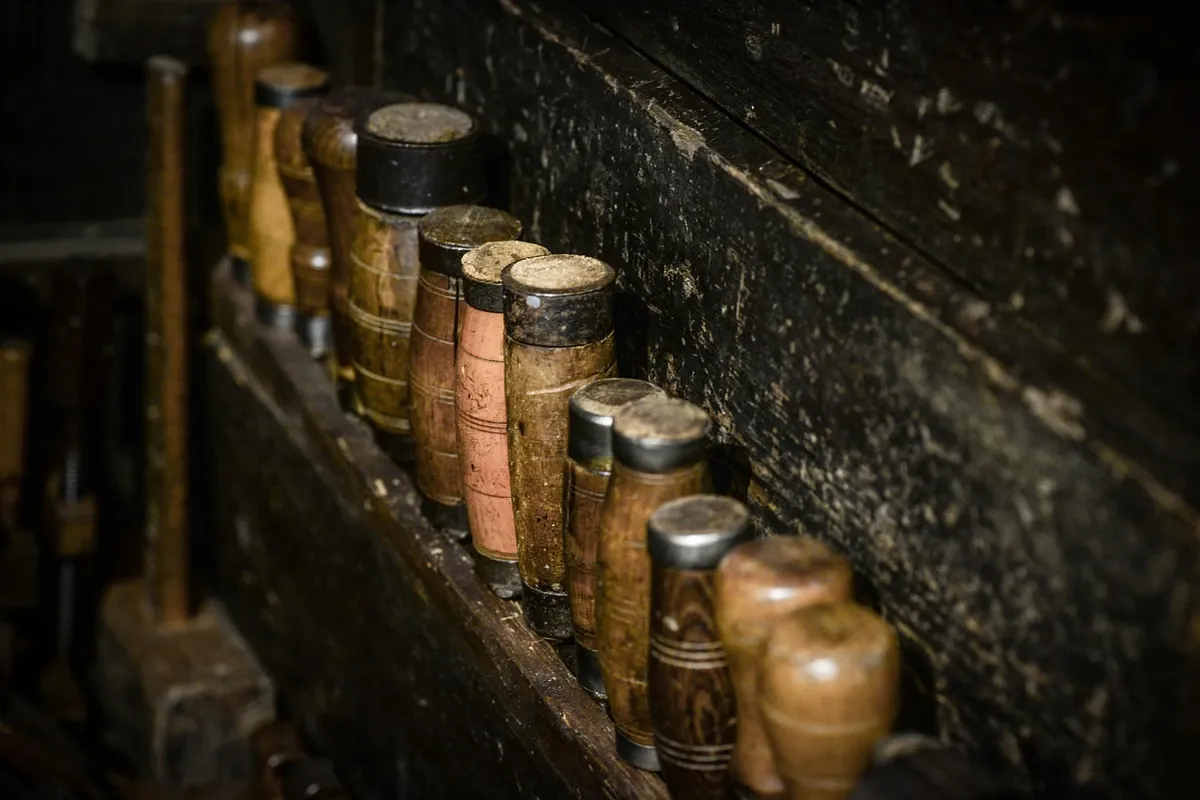 Set of wood chisels laid out on a workbench