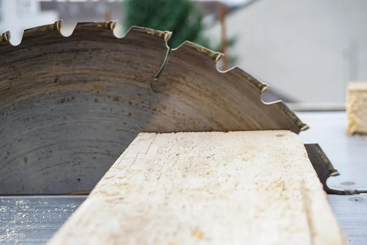Circular-style saw blade exposed during a cut