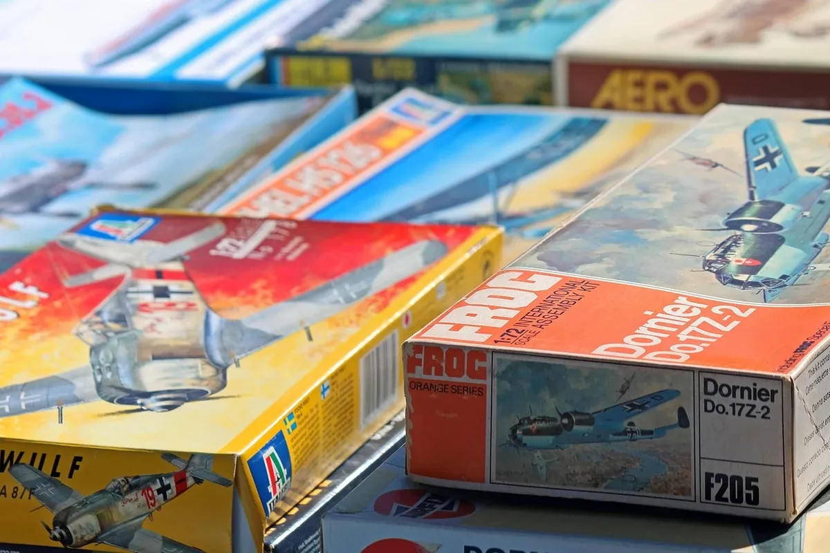Table of secondhand items laid out for sale at a market