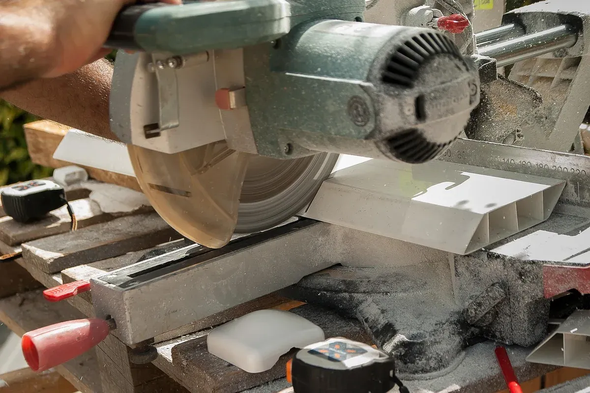 Circular saw cutting through a board