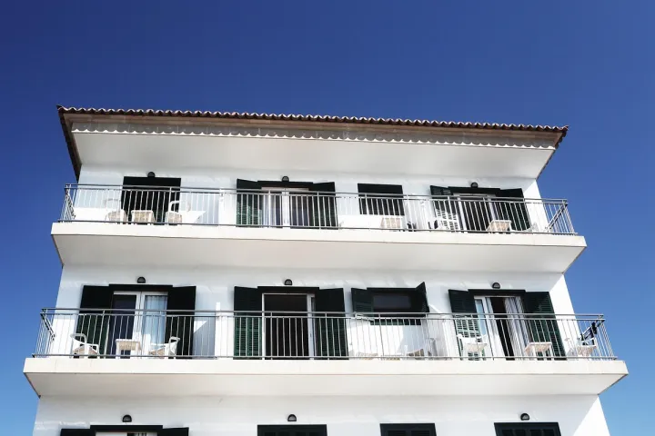 Apartment building facade with multiple balconies