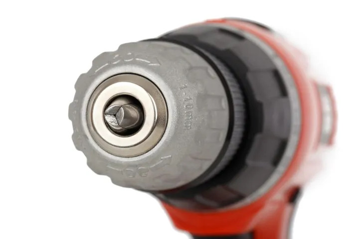 Cordless power tool with battery pack isolated on a workbench