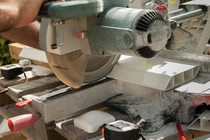 Circular saw cutting through a board